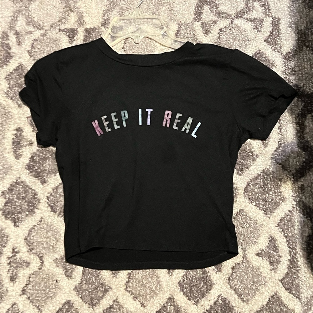 Black crop top “keep it real” writing